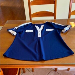Women’s Flattering Navy Blue Short Sleeve Top with White Trim.